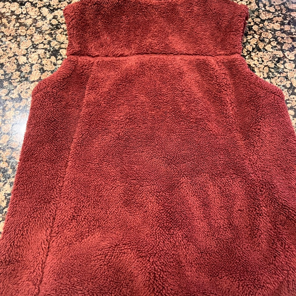 The NorthFace womens vest. Size small. No rips, stains, tears or smells.
